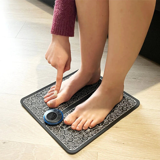 Person stepping onto a foot mat with a sensor on a wooden floor