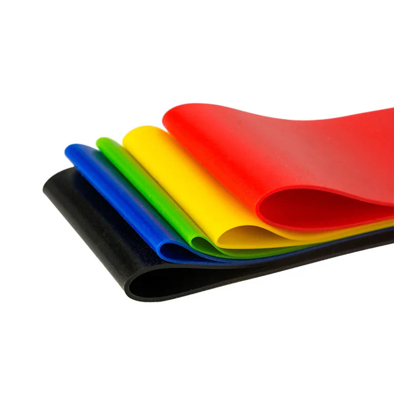Set of colorful resistance bands on a white background
