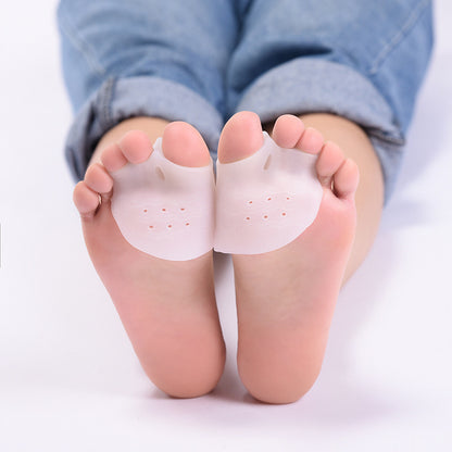 best bunion correctors for women - Silicone foot pads on a person's feet with rolled-up jeans.