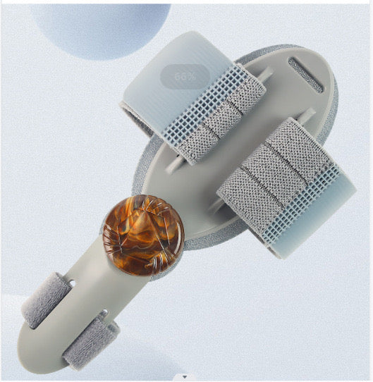 toe bunion corrector - Gray and white baby sandal with a brown bead on a light blue background